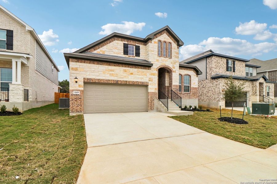 Front exterior of a new home in Sagebrooke - Classic Series, San Antonio, TX, highlighting curb appeal (Image 21).