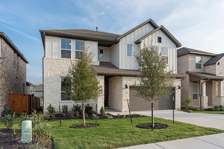 Front exterior of a new home in Park Collection at Lariat, Liberty Hill, TX, highlighting curb appeal (Image 25). Front exterior of a new home in Park Collection at Lariat, Liberty Hill, TX, highlighting curb appeal (Image 25).