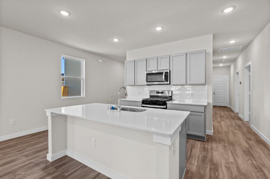 A kitchen with white cabinets. A kitchen with white cabinets.