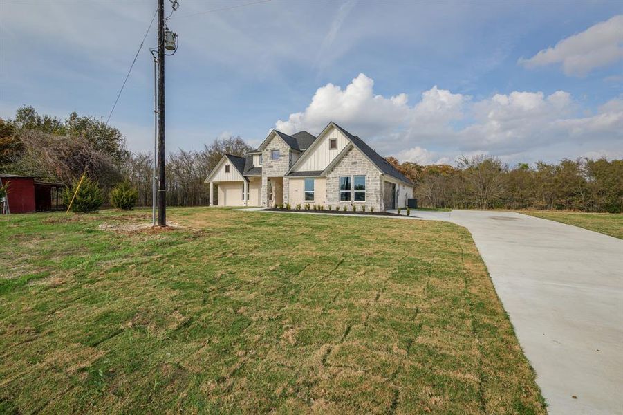 Front exterior of a new home in , Terrell, TX, highlighting curb appeal (Image 22).
