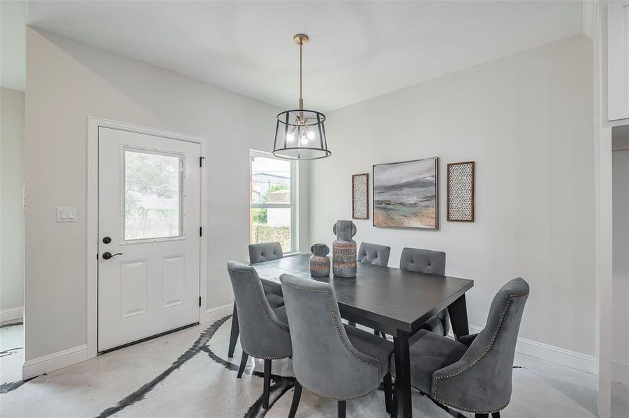 Dining area with an inviting chandelier