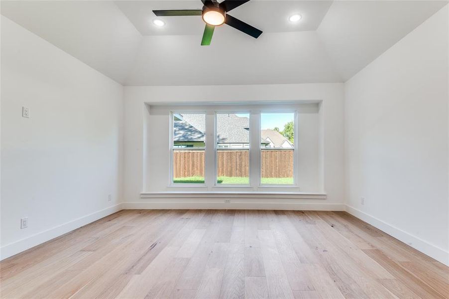 Master Bedroom with light wood-type flooring, ceiling fan, and recessed lighting