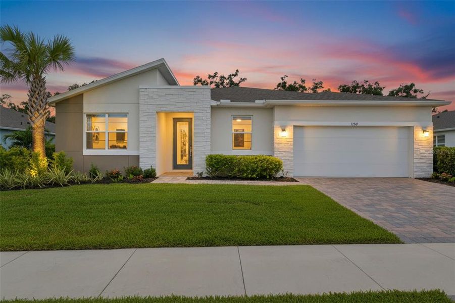 Front exterior of a new home in , Parrish, FL, highlighting curb appeal (Image 24).