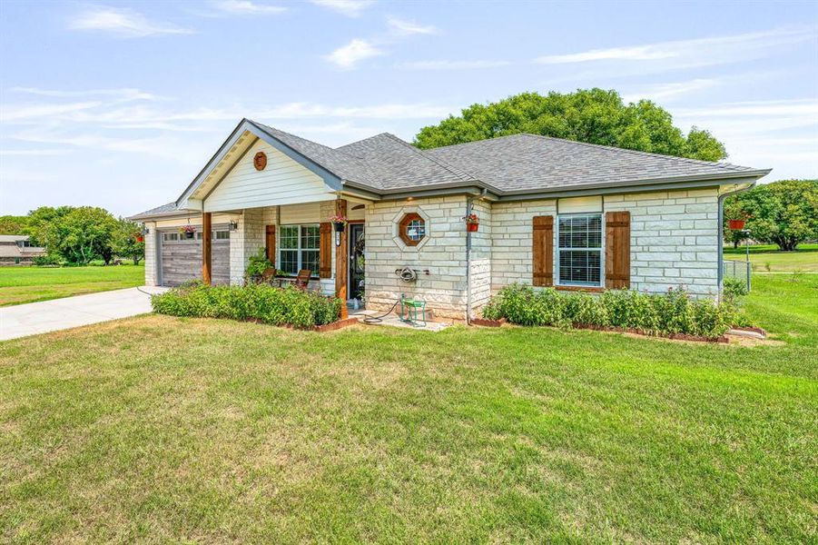 Front exterior of a new home in , Comanche, TX, highlighting curb appeal (Image 21).