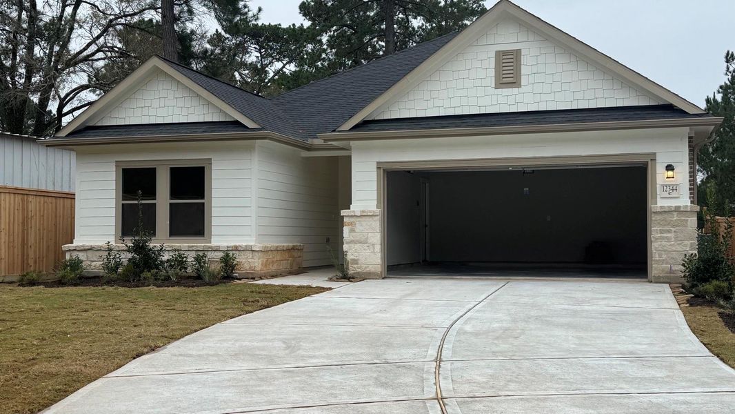 Front exterior of a new home in Westridge Cove, Conroe, TX, highlighting curb appeal (Image 2). Front exterior of a new home in Westridge Cove, Conroe, TX, highlighting curb appeal (Image 2).