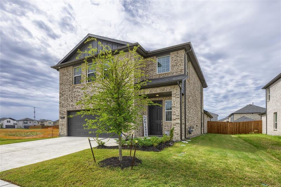 This angle clearly highlights the generous, additional spacing between properties, beautifully framed by the well-maintained lawn and a premium board-on-board privacy fence.