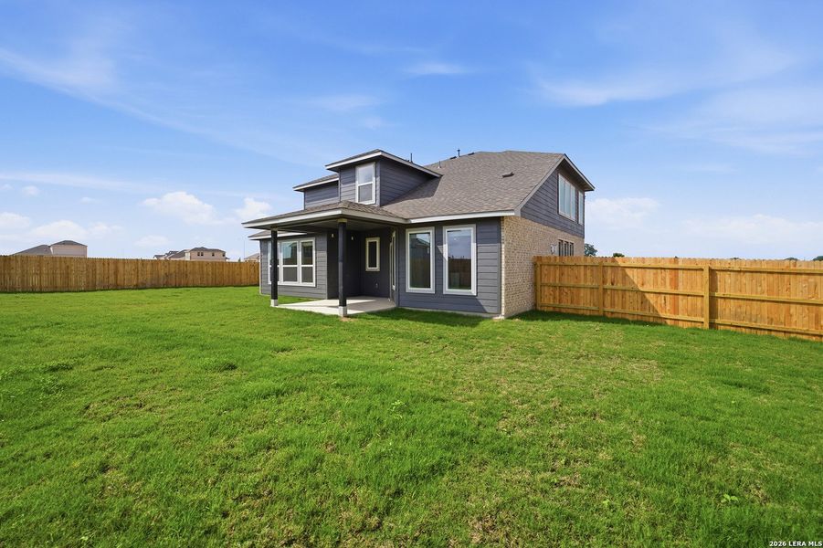 Exterior details and patio area of a home in Hickory Ridge, Elmendorf (Image 4).