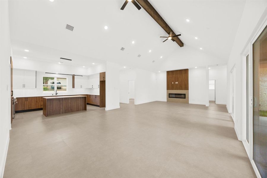 Open-concept design seamlessly connects the living room, kitchen, and dining areas for effortless entertaining.