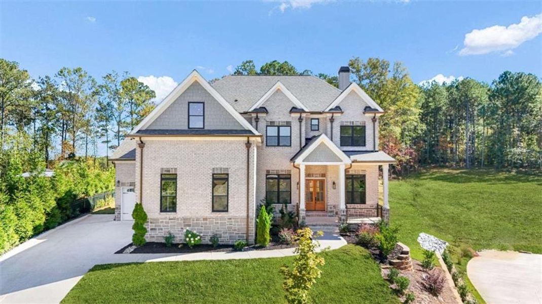 Front exterior of a new home in , Lawrenceville, GA, highlighting curb appeal (Image 1).