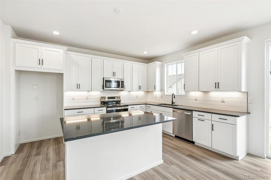 Furnished interior view inside a new home in Windsong, Thornton (Image 7).
