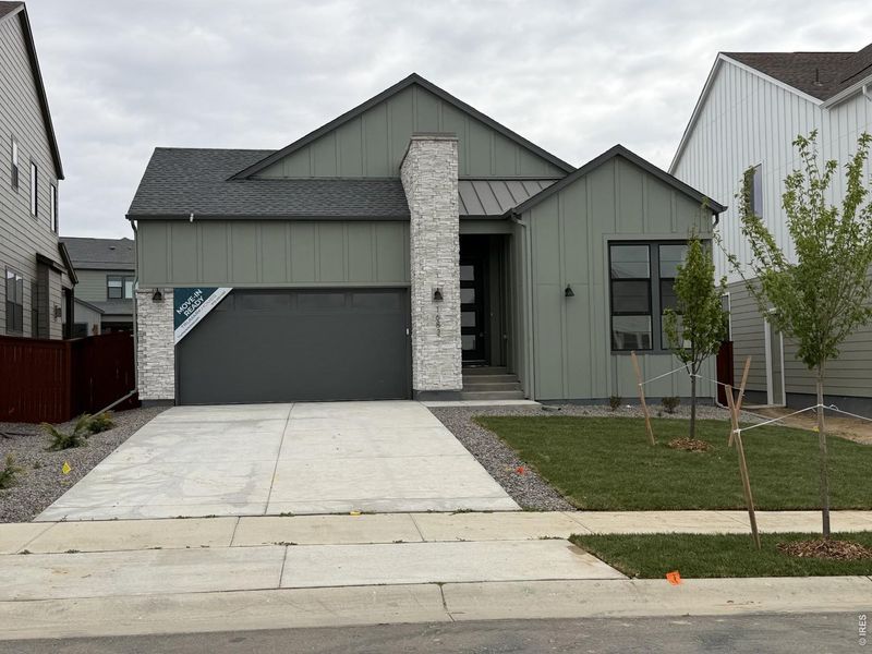 Front exterior of a new home in RainDance, Windsor, CO, highlighting curb appeal (Image 1). Front exterior of a new home in RainDance, Windsor, CO, highlighting curb appeal (Image 1).