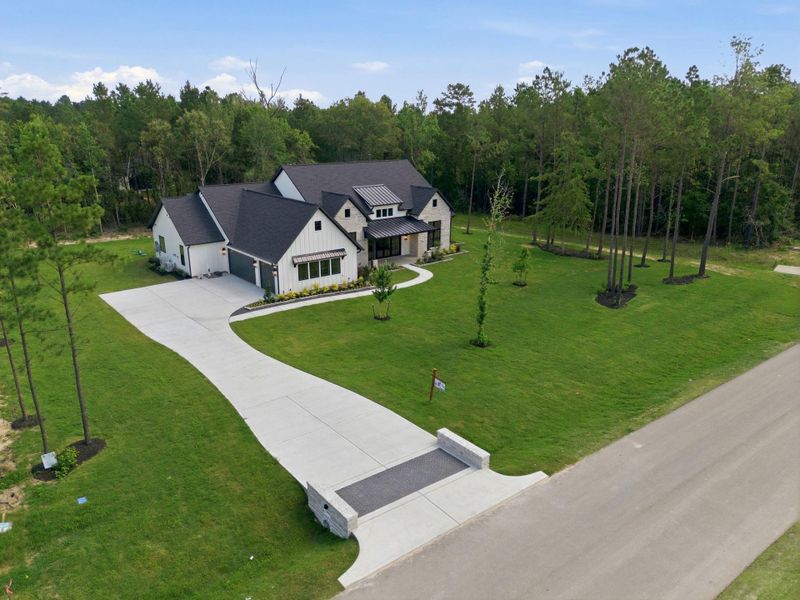 Front exterior of a new home in , Montgomery, TX, highlighting curb appeal (Image 28).