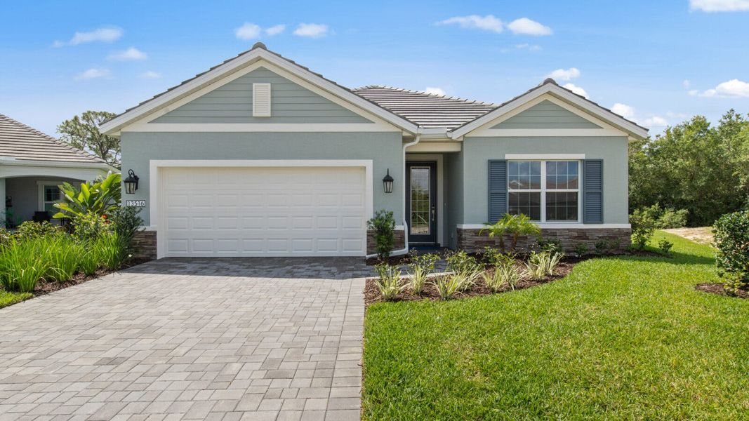 Front exterior of a new home in Verandah Real Estate and Homes for Sale in Fort Myers, FL - Neal Communities, Fort Myers, FL, highlighting curb appeal (Image 1). Front exterior of a new home in Verandah Real Estate and Homes for Sale in Fort Myers, FL - Neal Communities, Fort Myers, FL, highlighting curb appeal (Image 1).