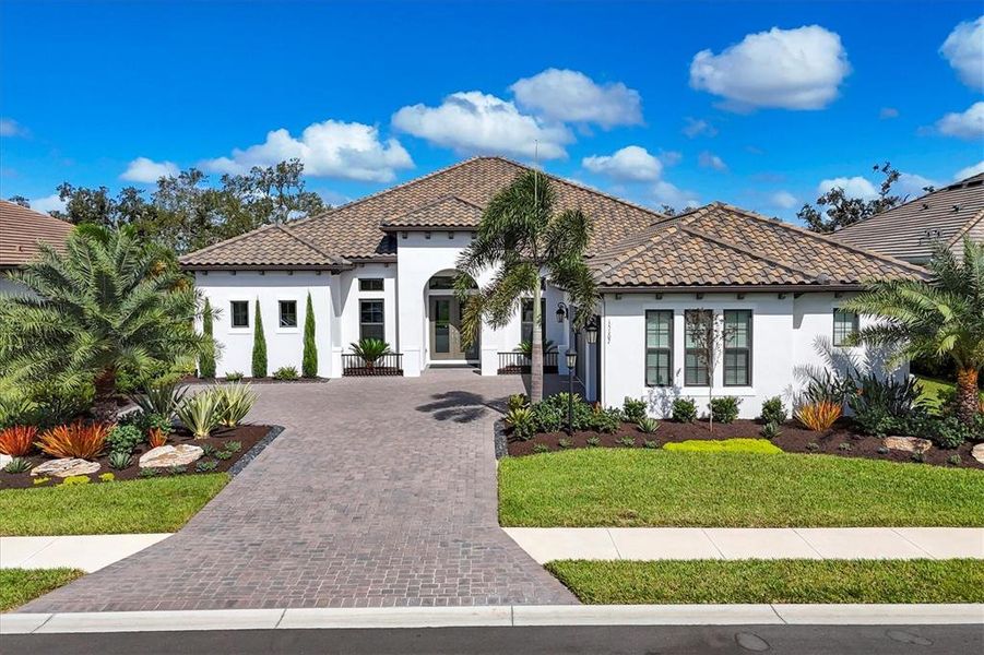 Front exterior of a new home in , Lakewood Ranch, FL, highlighting curb appeal (Image 1).