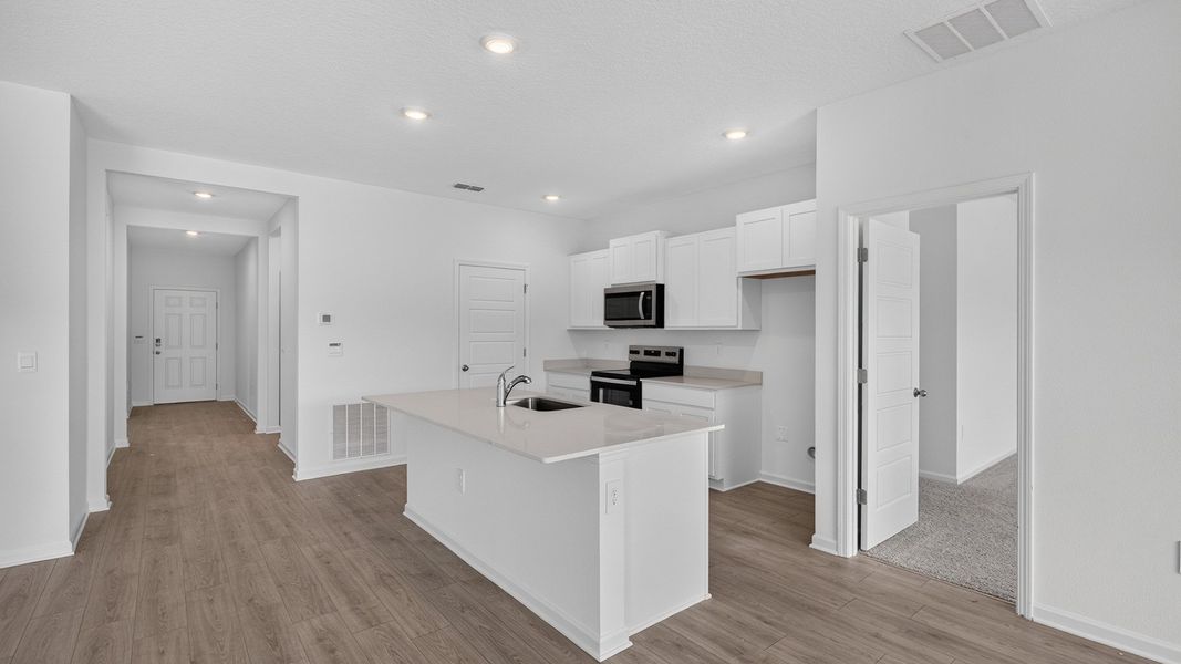 Representative furnished interior of a home built from the Aria+ by D.R. Horton in Diamond Springs, Jacksonville (Image 7).