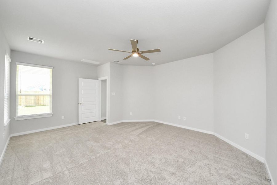 Come decompress in the stunning primary suite after a lengthy day! Experience the luxury of plush carpeting, warm paint hues, high ceilings, and large windows featuring privacy blinds. Sample photo of completed home with similar floor plan. Actual colors and selections may vary. Come decompress in the stunning primary suite after a lengthy day! Experience the luxury of plush carpeting, warm paint hues, high ceilings, and large windows featuring privacy blinds. Sample photo of completed home with similar floor plan. Actual colors and selections may vary.