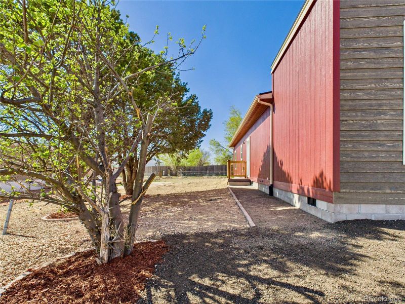 Front exterior of a new home in , Pueblo West, CO, highlighting curb appeal (Image 2).