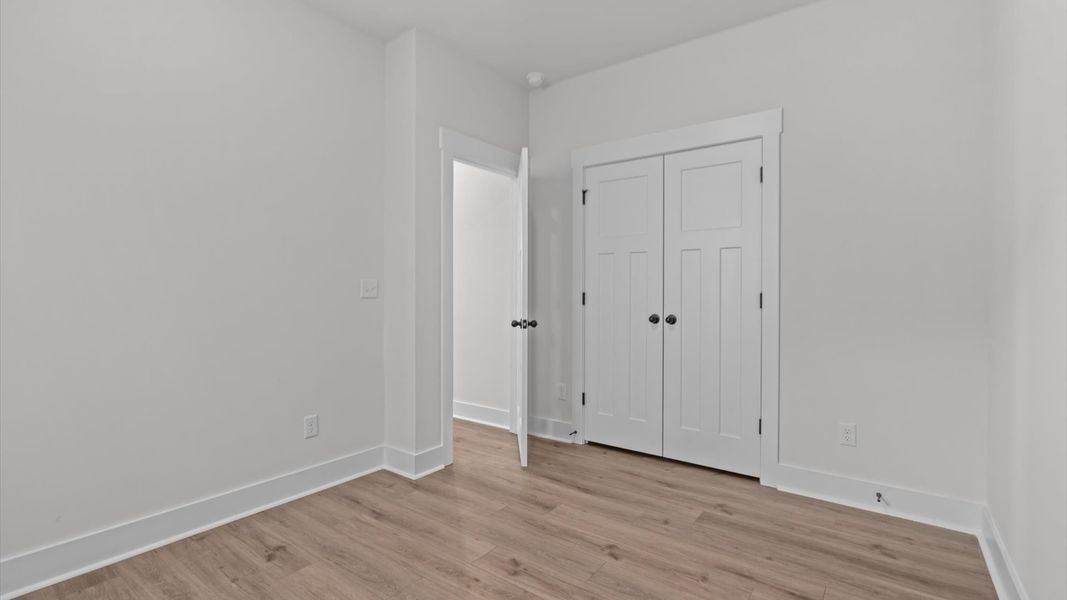 Superior hardwood flooring enhances the comfort and style of every secondary bedroom