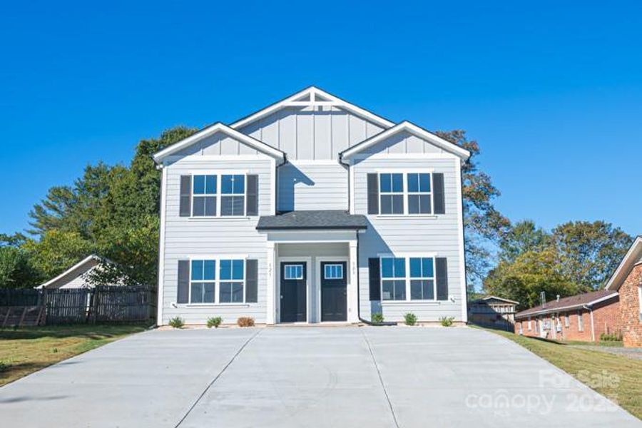 Front exterior of a new home in , Hickory, NC, highlighting curb appeal (Image 1).