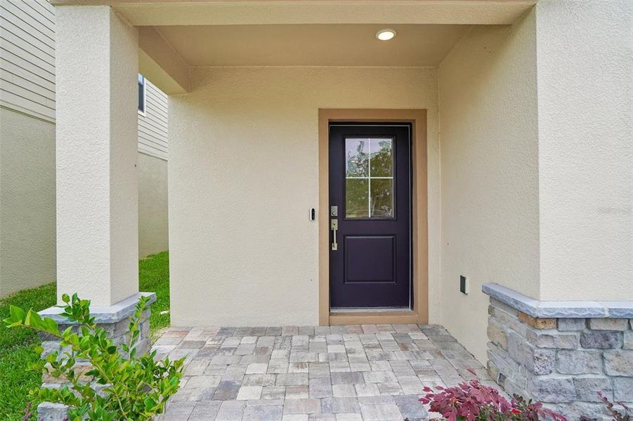 Exterior details and patio area of a home in Grasslands West, Lakeland (Image 3).