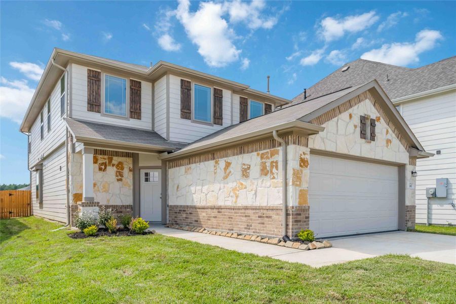 Front exterior of a new home in The Landing, New Caney, TX, highlighting curb appeal (Image 1). Front exterior of a new home in The Landing, New Caney, TX, highlighting curb appeal (Image 1).