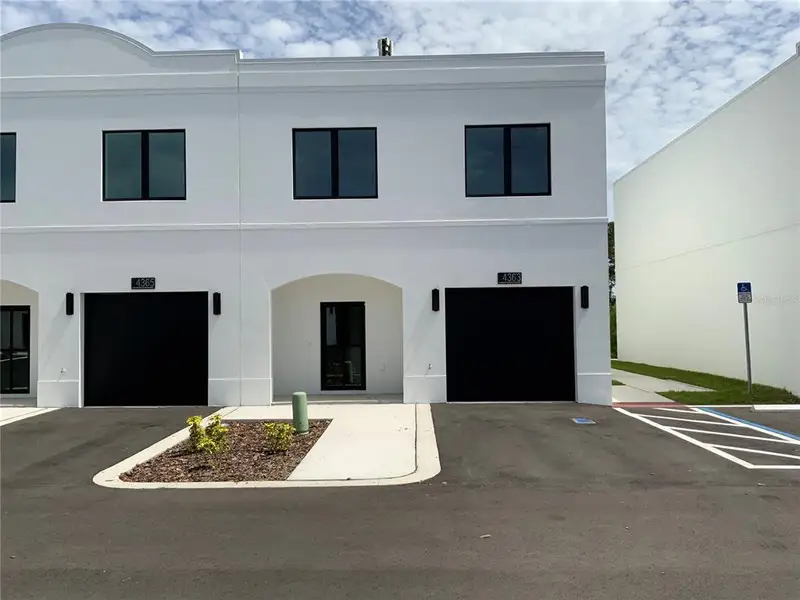 Front exterior of a new home in , Tampa, FL, highlighting curb appeal (Image 1). Front exterior of a new home in , Tampa, FL, highlighting curb appeal (Image 1).