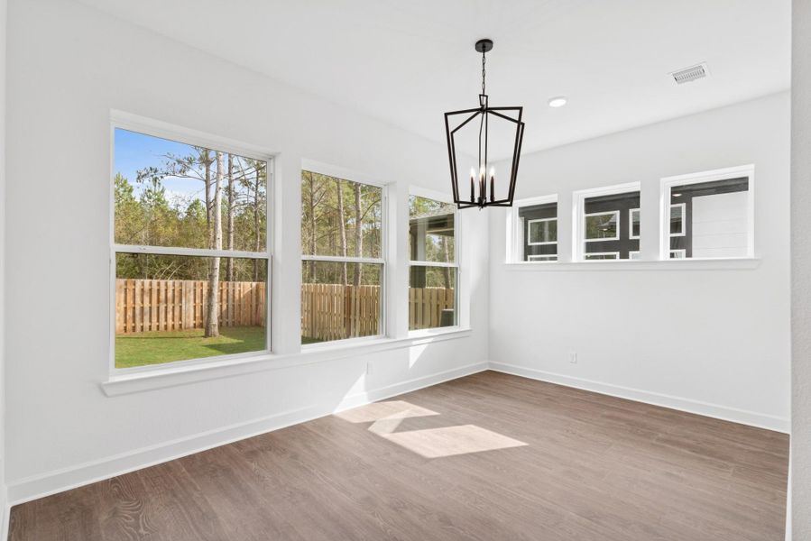 Spacious Dining area that is encapsulated by lots of windows for light!