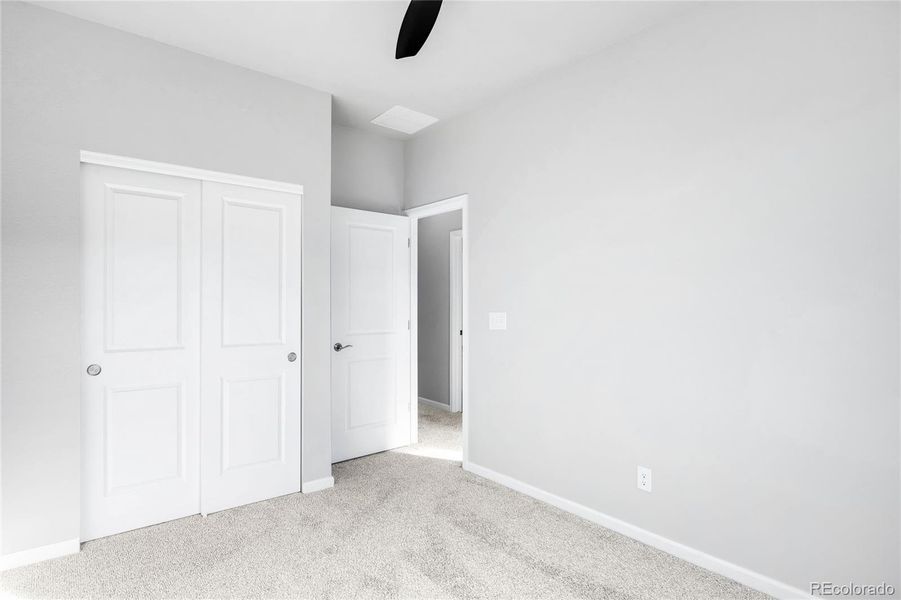 The third bedroom, located on the upper level.