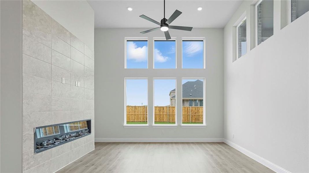 Spacious interior with high ceilings and wood-finish flooring