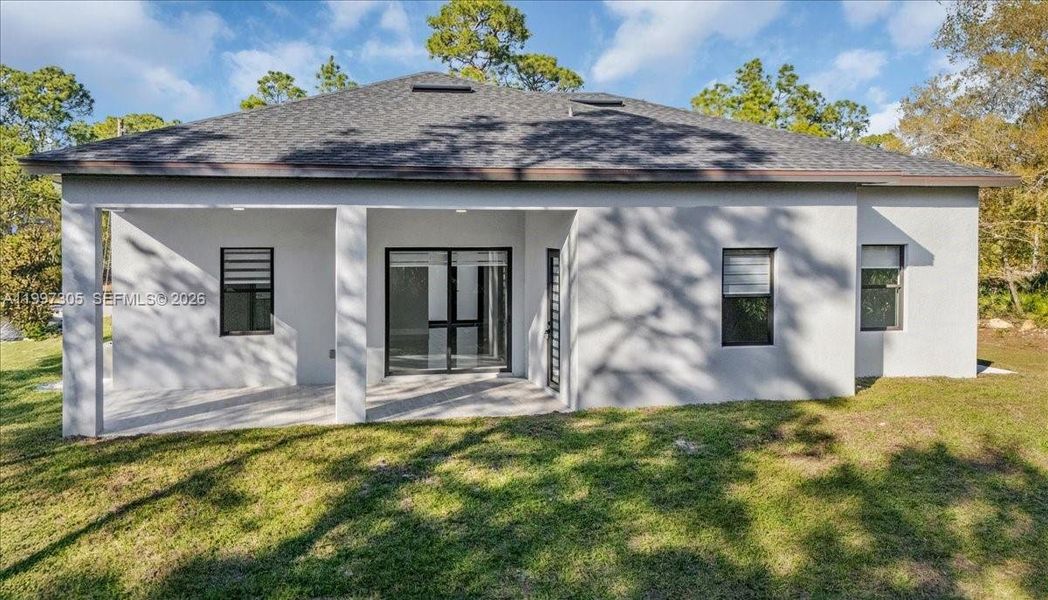 Exterior details and patio area of a home in , Lehigh Acres (Image 4).