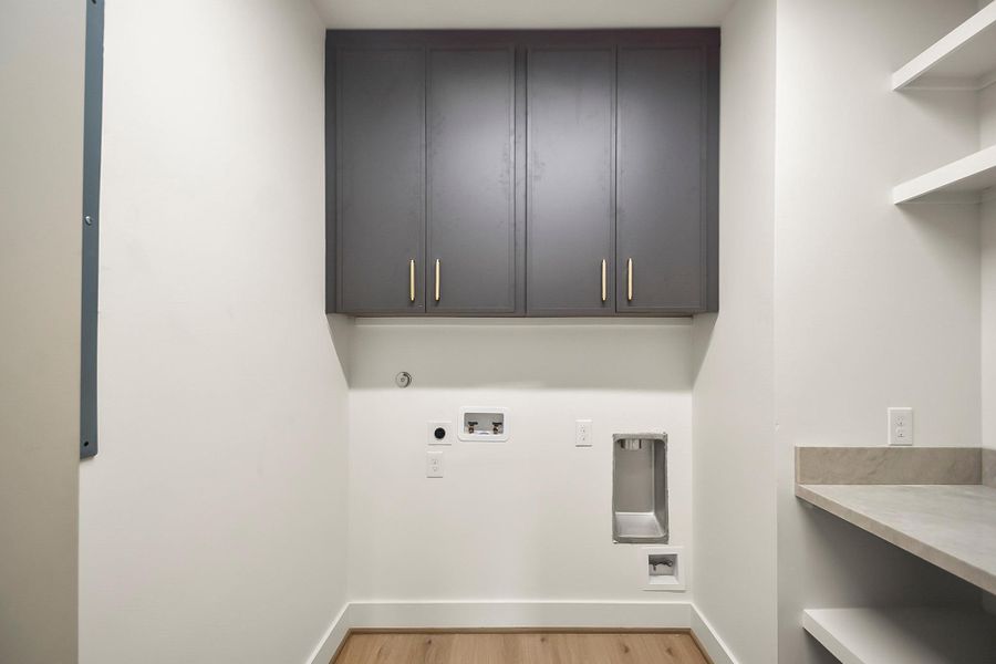 Thoughtfully positioned within the home, this space combines practicality with refined finishes to make daily routines seamless and efficient.