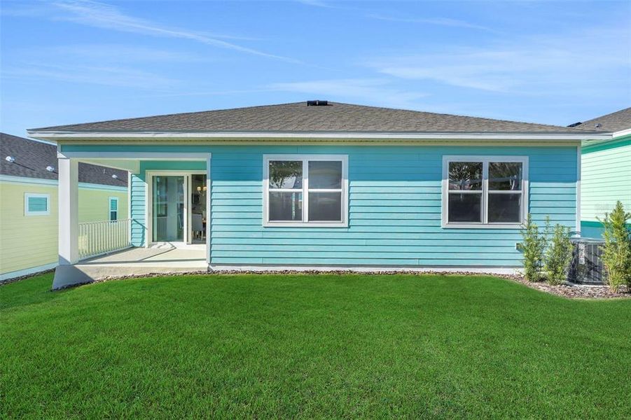 Exterior details and patio area of a home in Green Key Village, Lady Lake (Image 26).