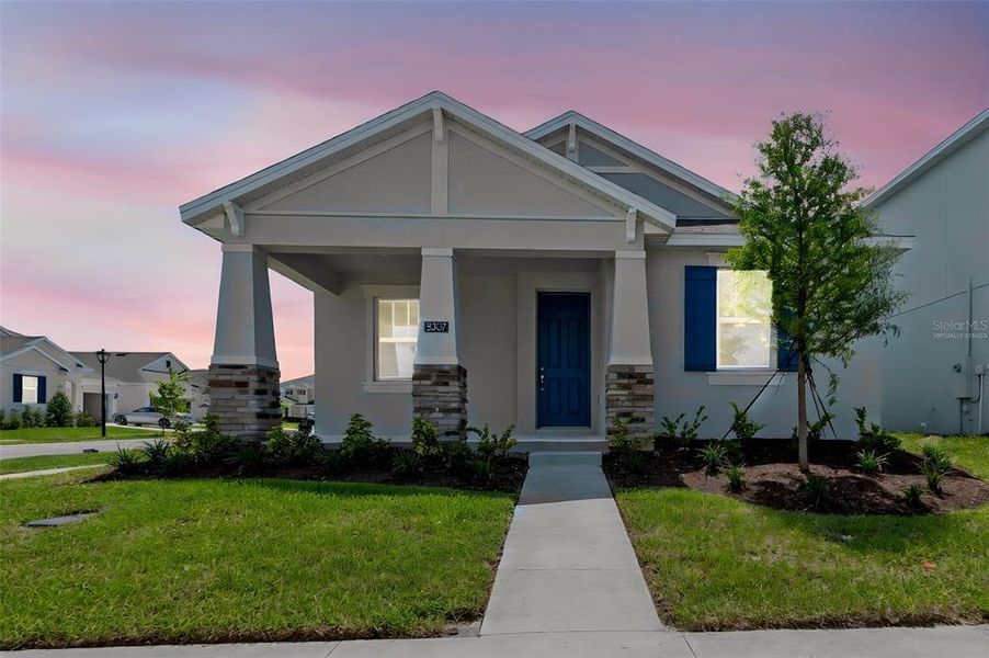 Front exterior of a new home in Crossroads at Kelly Park, Apopka, FL, highlighting curb appeal (Image 33).