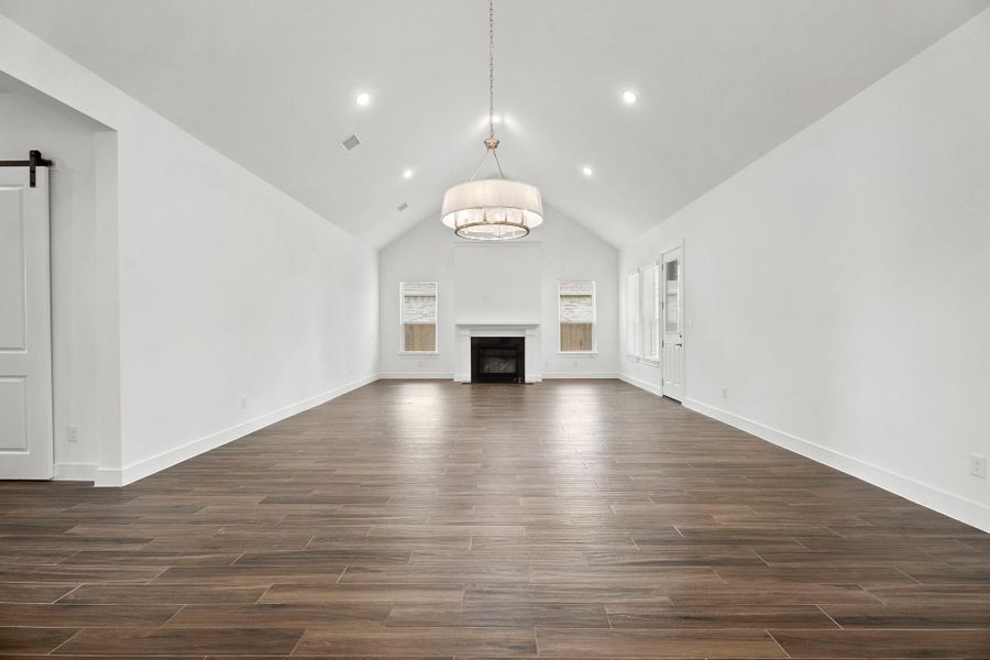 Open dining area and great room with fireplace (*Photo not of actual home and used for illustration purposes only.)