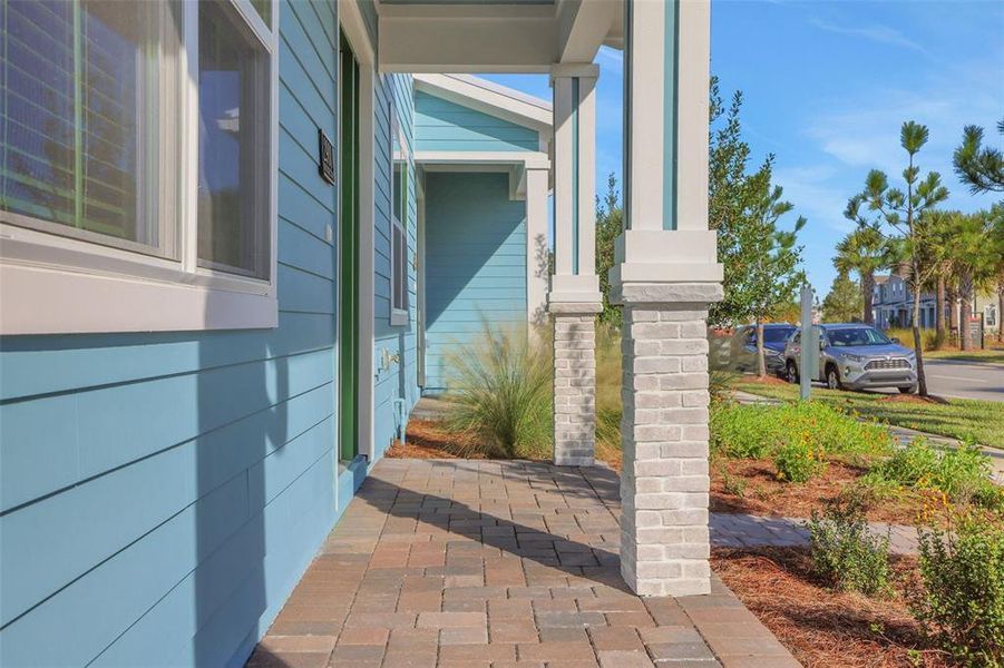 Exterior details and patio area of a home in Weslyn Park at Sunbridge (Craft Homes), St. Cloud (Image 20).