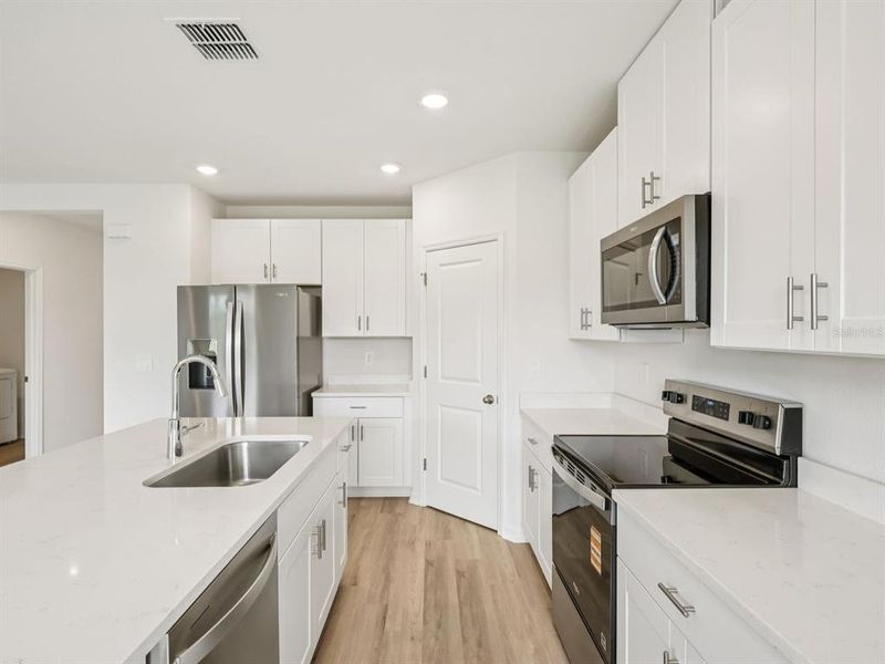 Furnished interior view inside a new home in The Reserve at Van Oaks, Auburndale (Image 7).
