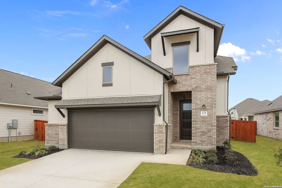 Front exterior of a new home in Megan's Landing, Castroville, TX, highlighting curb appeal (Image 16).