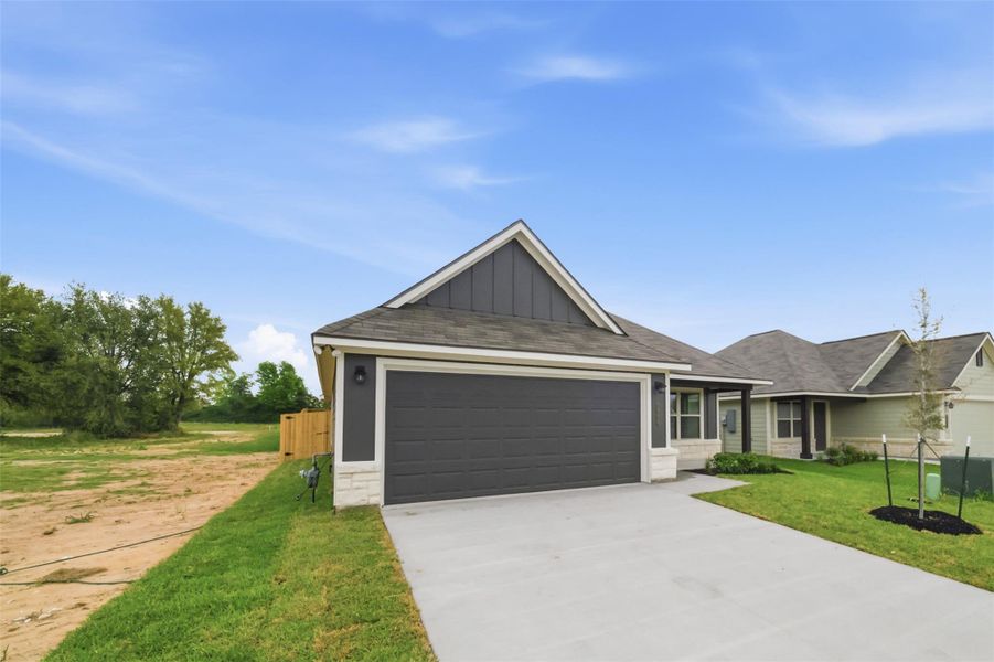 Front exterior of a new home in , Navasota, TX, highlighting curb appeal (Image 16).