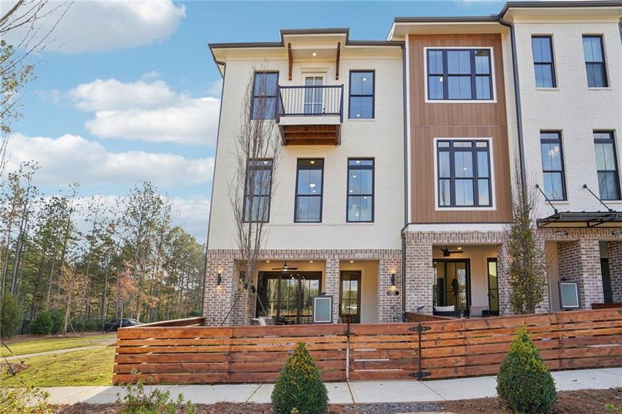Front exterior of a new home in IveyBrooke, Alpharetta, GA, highlighting curb appeal (Image 24). Front exterior of a new home in IveyBrooke, Alpharetta, GA, highlighting curb appeal (Image 24).