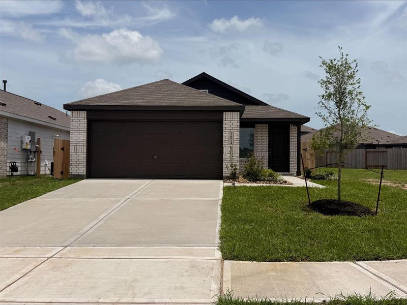 Front exterior of a new home in Sweetgrass Village, Crosby, TX, highlighting curb appeal (Image 25).