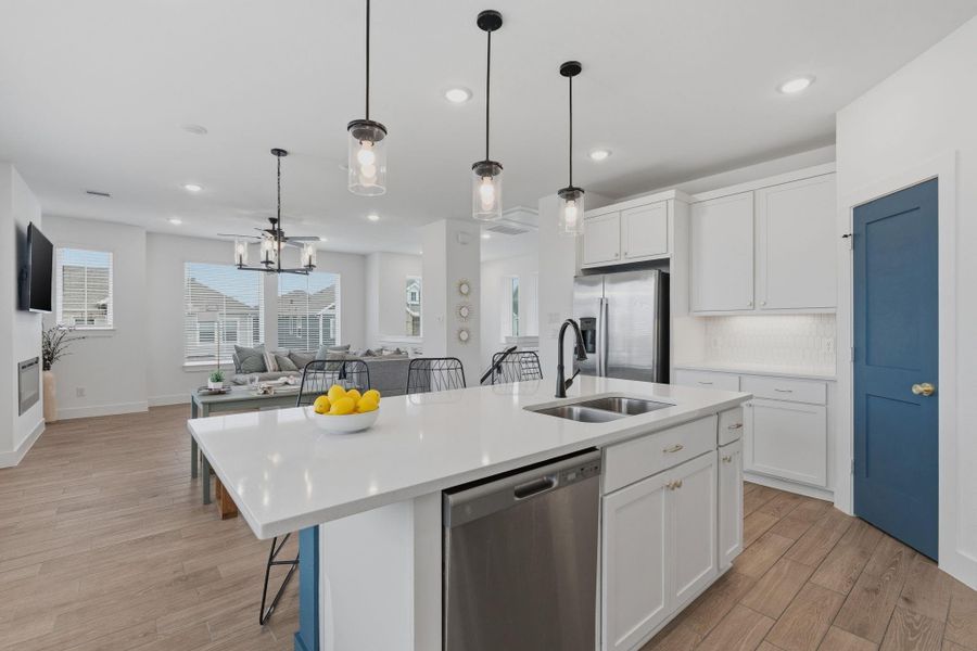 Large island, walk in pantry, quartz counters and pendant lights. no upgrades needed.