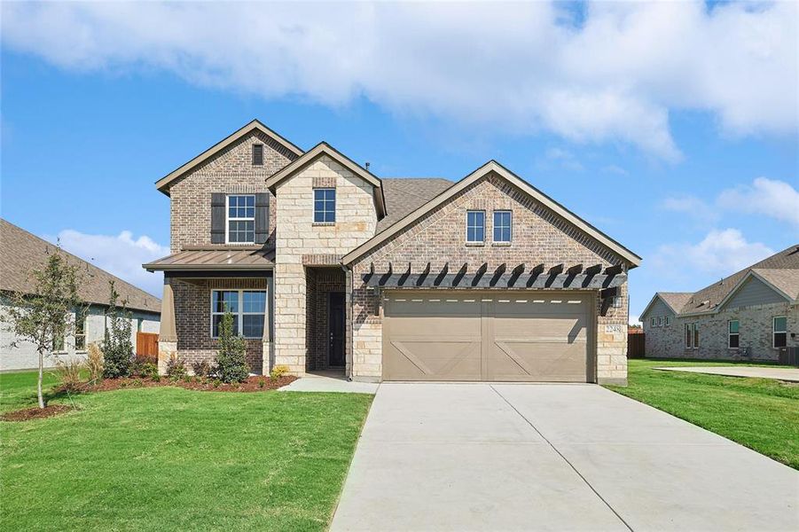 Craftsman-style home with a garage and a front lawn