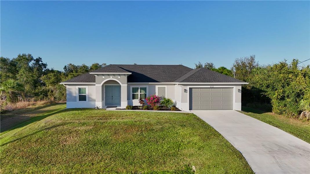 Front exterior of a new home in , North Port, FL, highlighting curb appeal (Image 25).