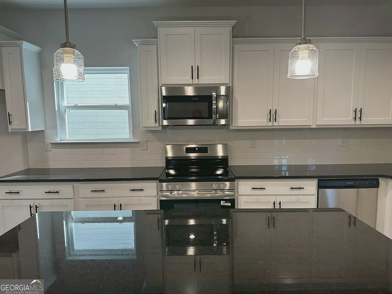Furnished interior view inside a new home in Canterbury Villas, Carrollton (Image 5).