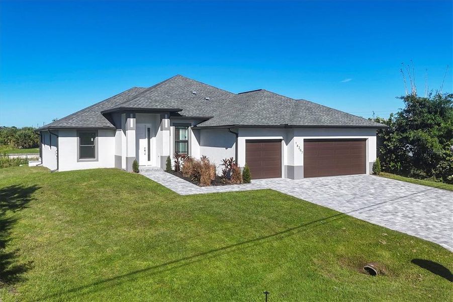 Front exterior of a new home in , Port Charlotte, FL, highlighting curb appeal (Image 2).