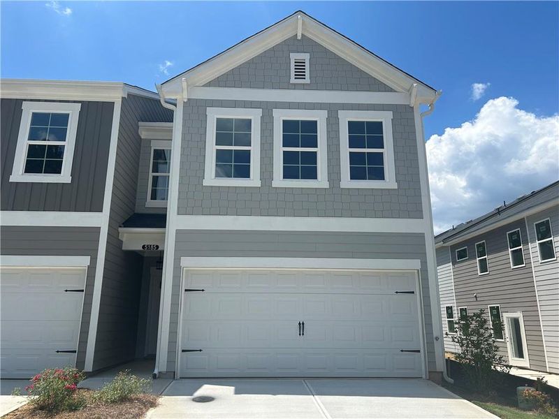 Front exterior of a new home in Longview Run, Decatur, GA, highlighting curb appeal (Image 1). Front exterior of a new home in Longview Run, Decatur, GA, highlighting curb appeal (Image 1).