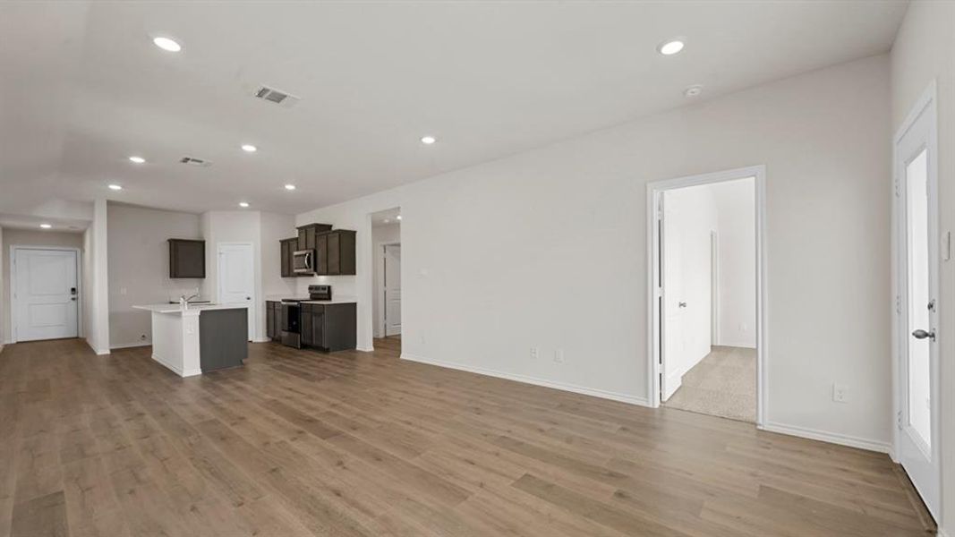 Unfurnished living room featuring recessed lighting and light wood-style flooring