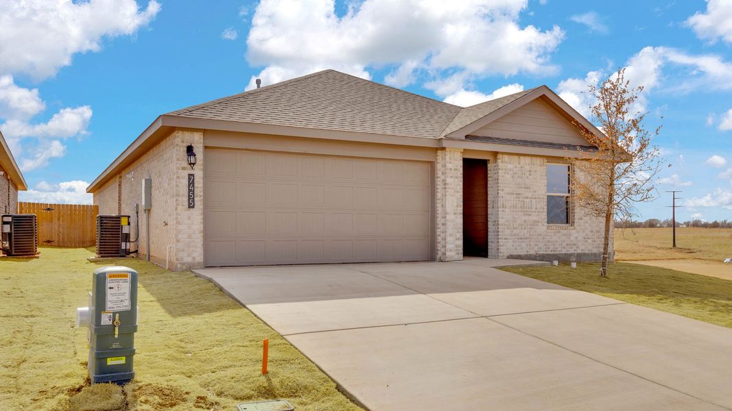 Front exterior of a new home in Terra Vista, Lubbock, TX, highlighting curb appeal (Image 15).