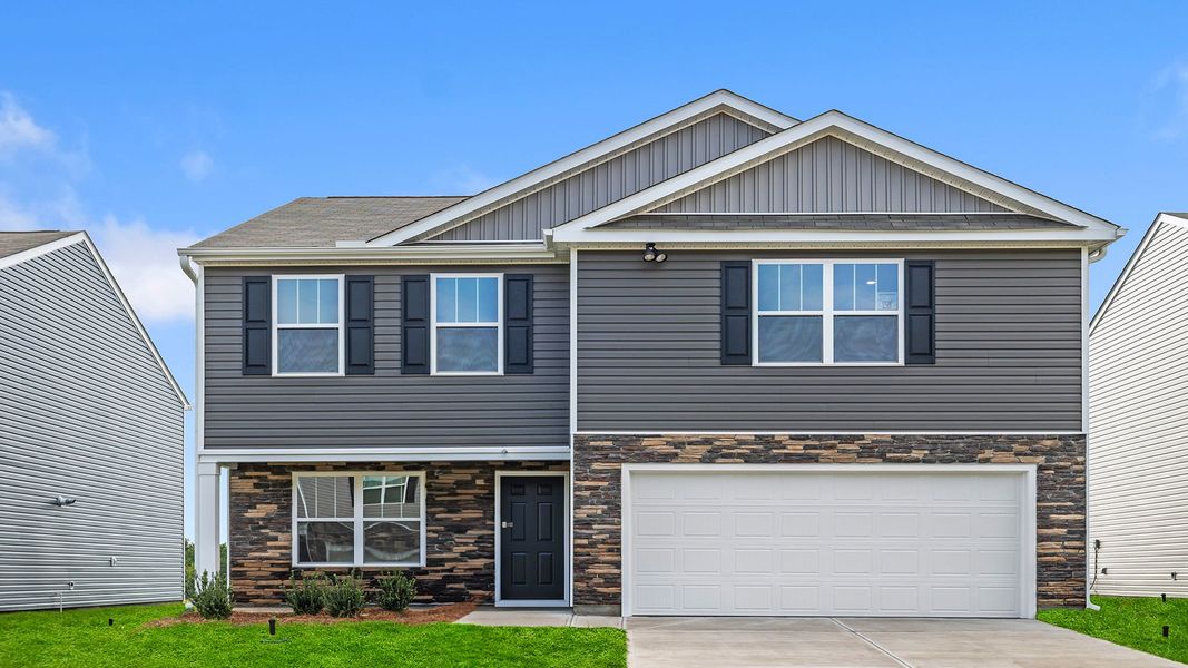 Front exterior of a new home in Lightwood Cottages, Moore, SC, highlighting curb appeal (Image 1).