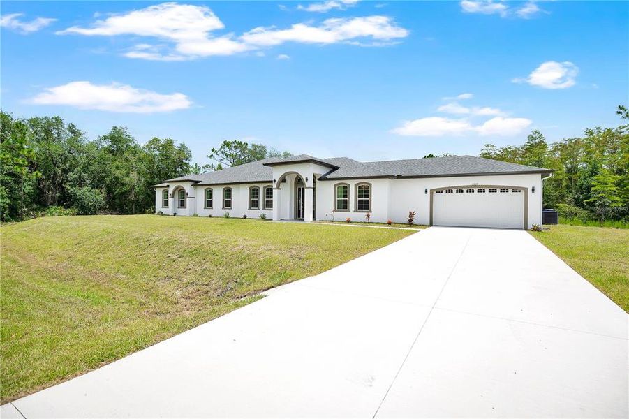 Front exterior of a new home in , Orlando, FL, highlighting curb appeal (Image 23). Front exterior of a new home in , Orlando, FL, highlighting curb appeal (Image 23).